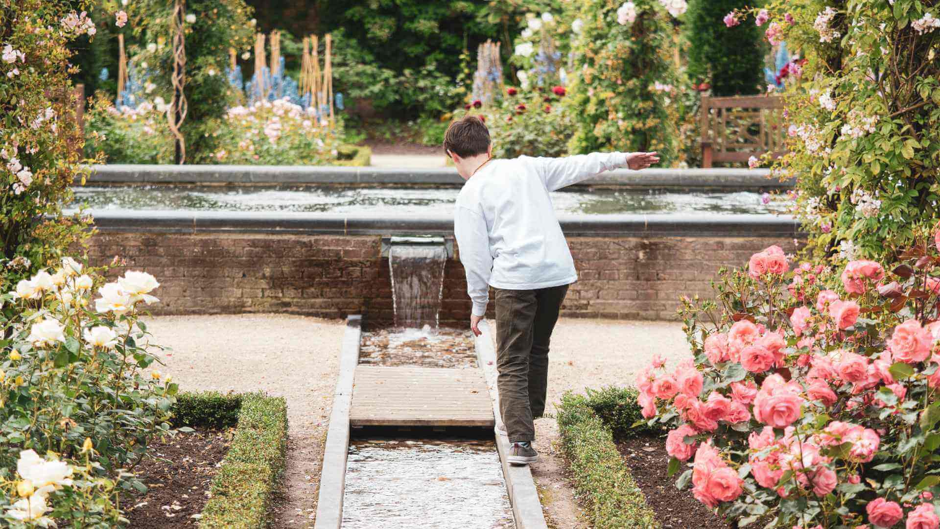 Kid playing in the Ornamental garden