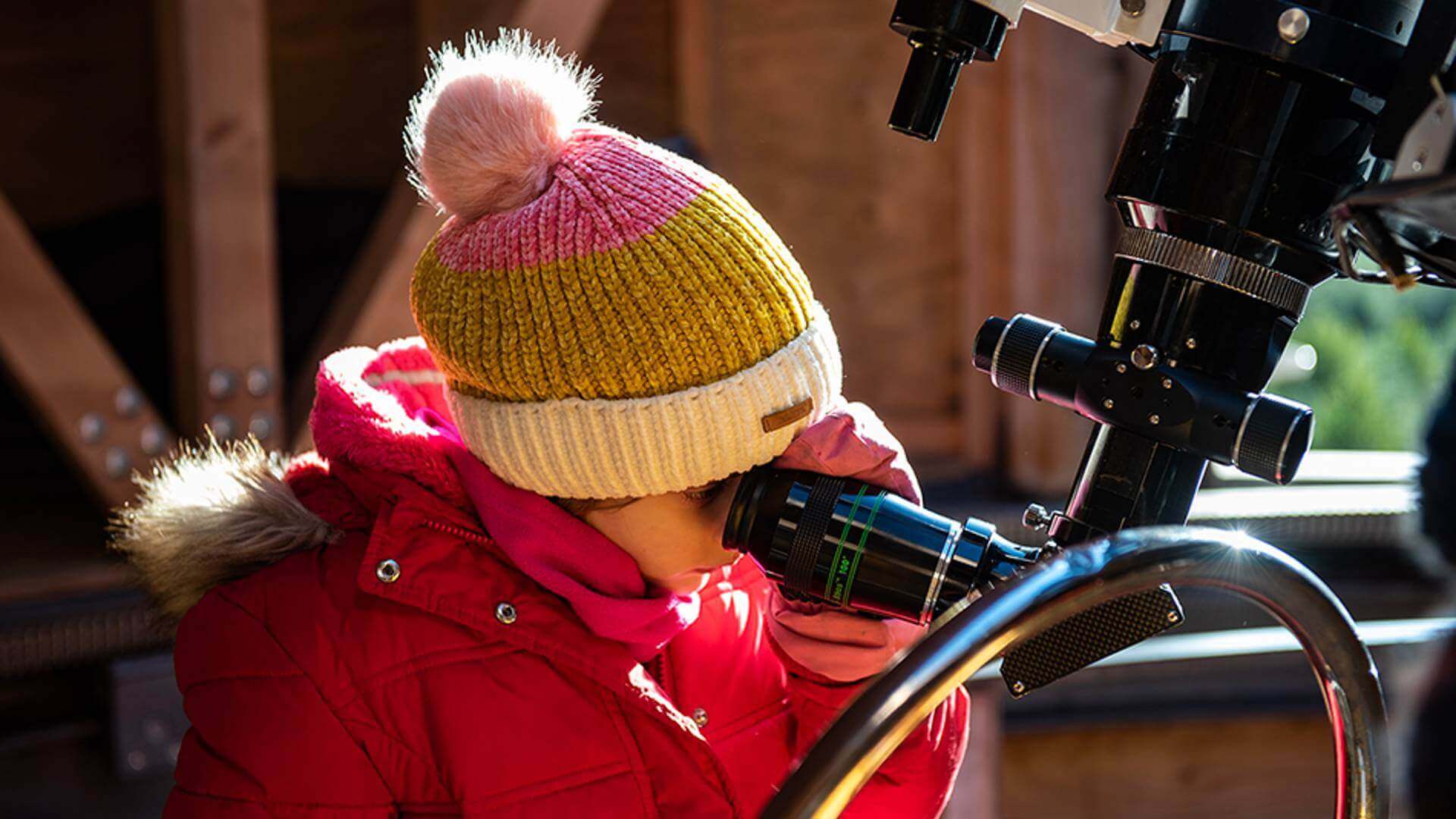 Child stargazing at Kielder Observatory
