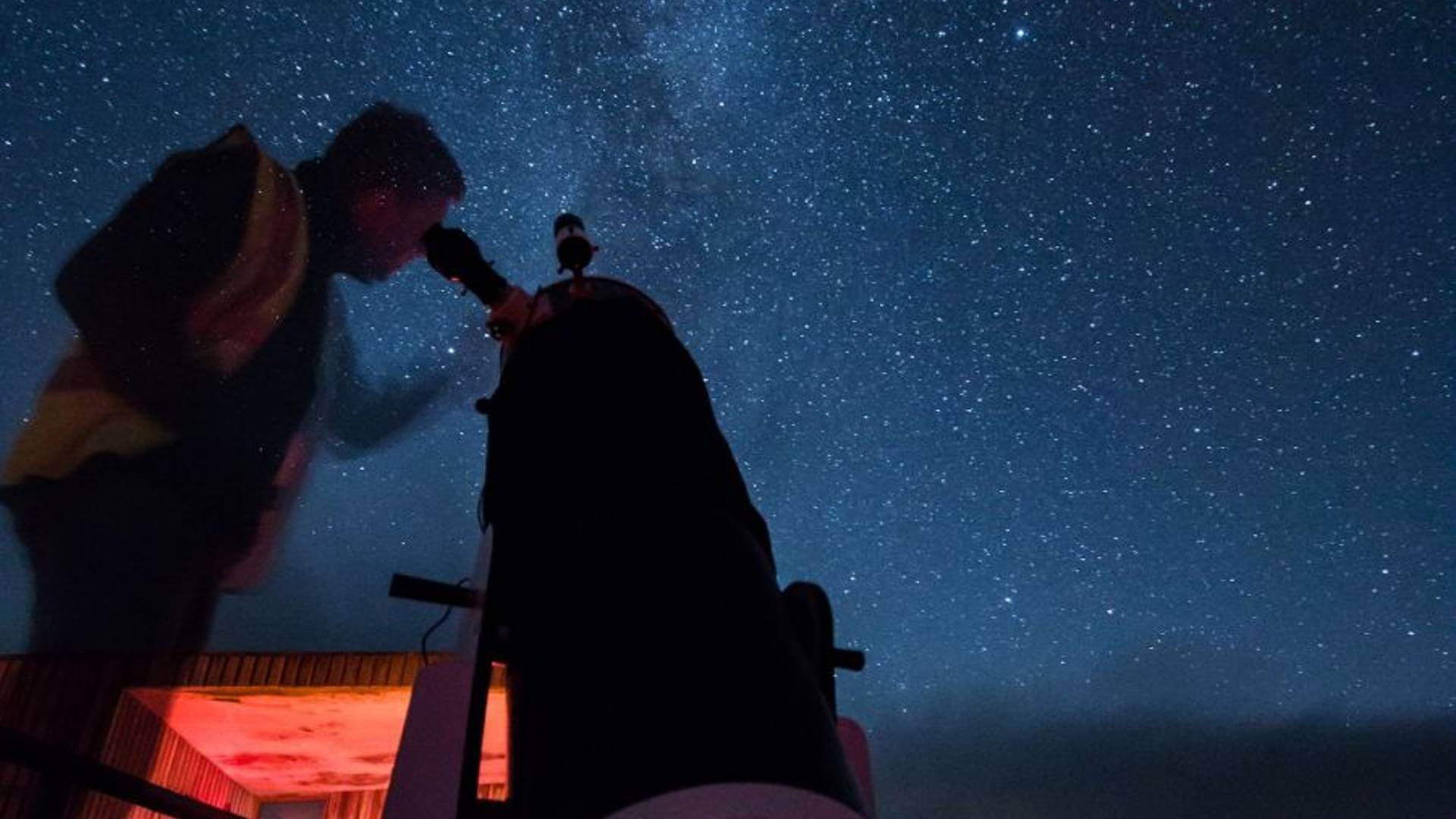 Man stargazing in Northumberland