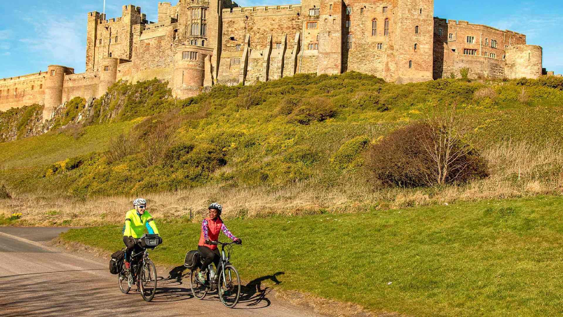 Cyclists at Bamburgh Castle