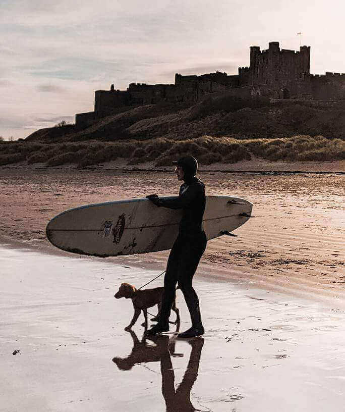 Surfing at Bamburgh in Northumberland