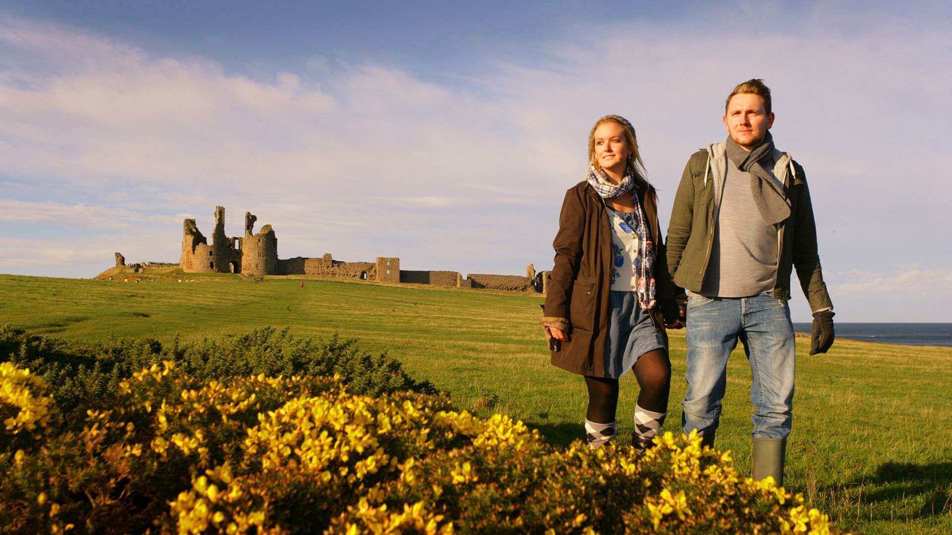 Couple enjoy a trip to Dunstanburgh Castle