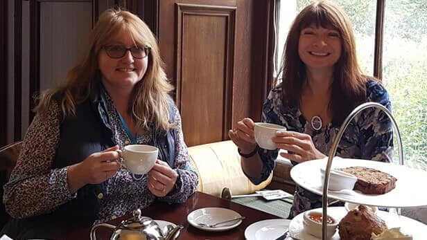 Two ladies enjoying afternoon tea