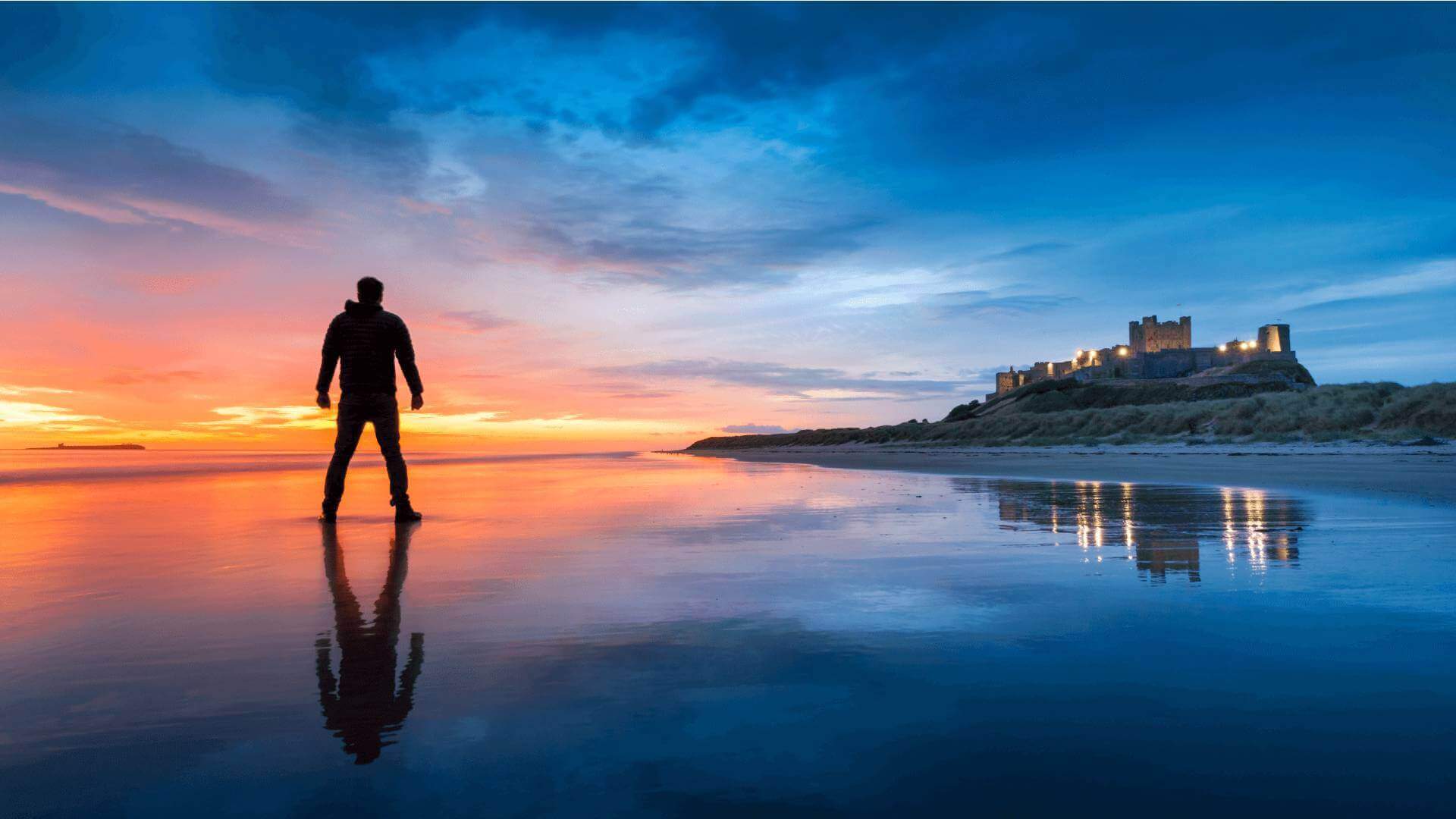 Man posing on Bamburgh Beach